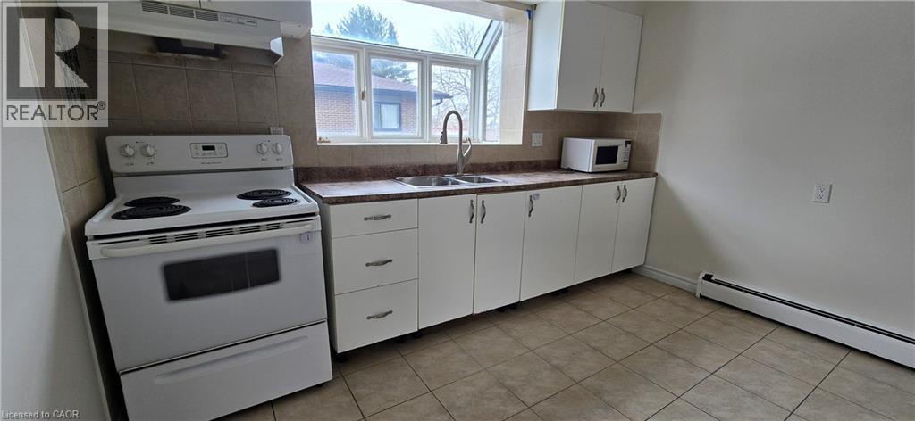23 Rutherford Drive Unit# B, Kitchener, ON - Indoor Photo Showing Kitchen With Double Sink