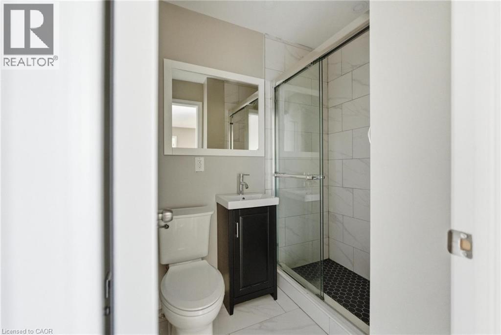 Bathroom with vanity, a stall shower, and light marble finish floors - 100 Beddoe Drive Unit# 25, Hamilton, ON - Indoor Photo Showing Bathroom