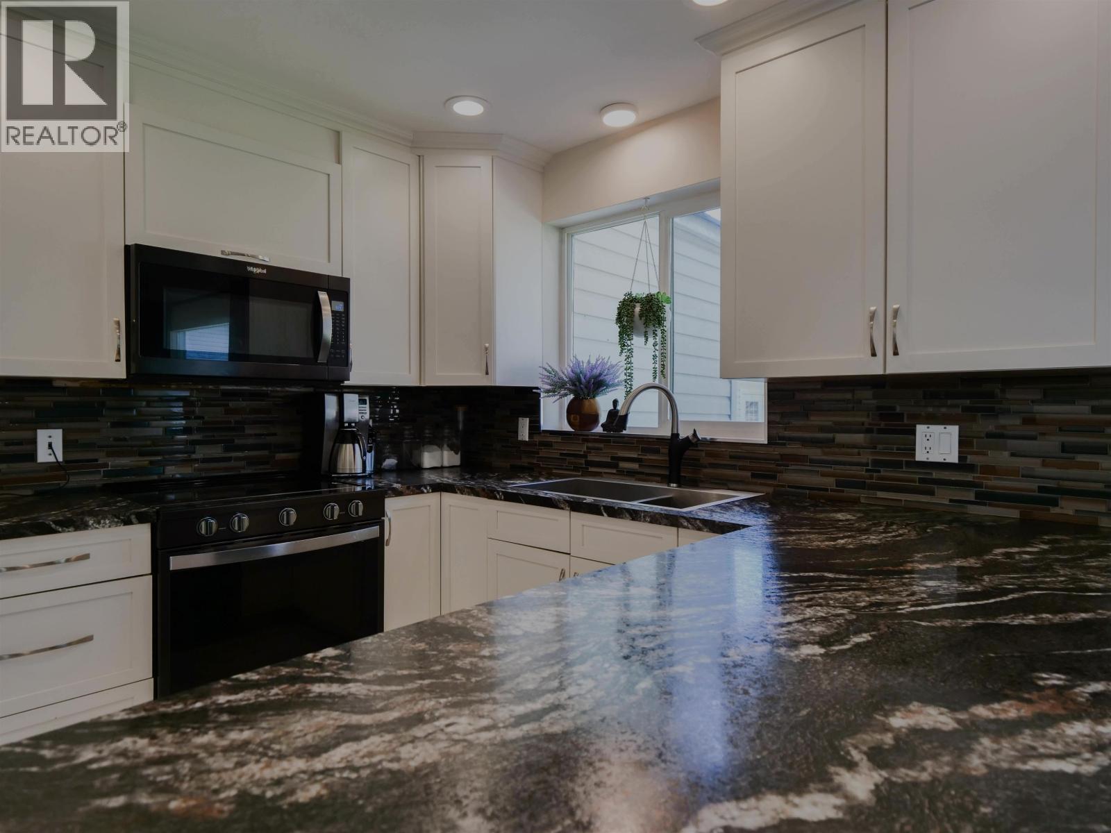 1750 Beach Crescent, Quesnel, BC - Indoor Photo Showing Kitchen With Double Sink