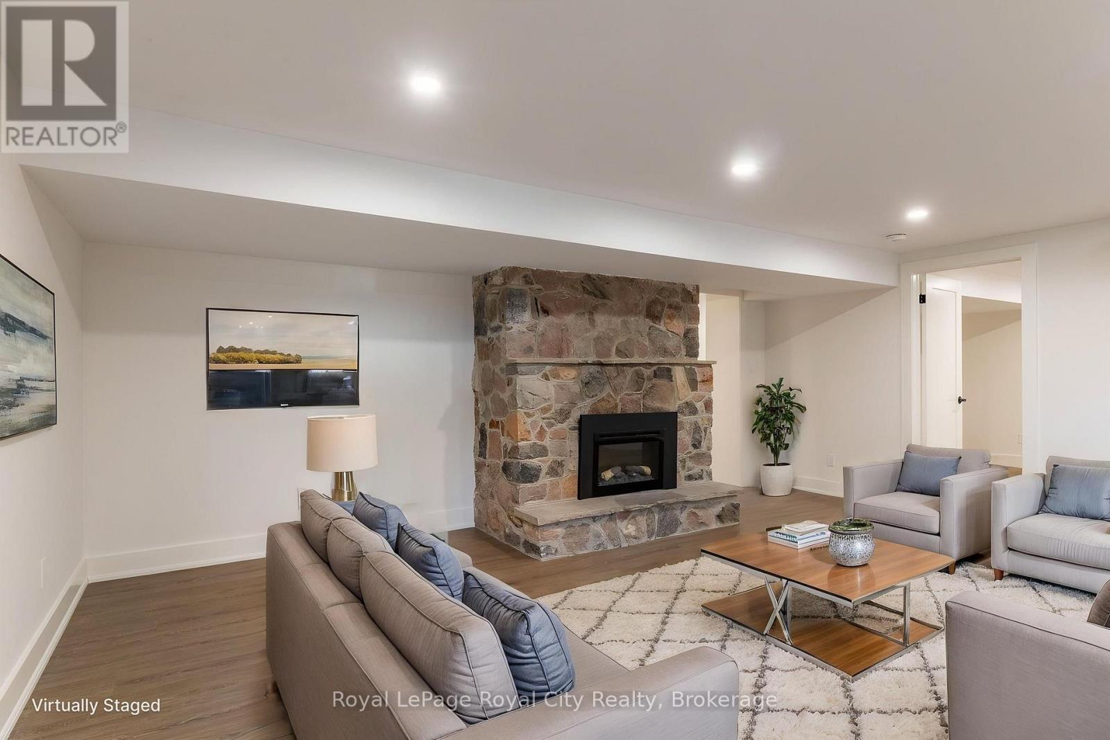 Living room - virtually staged - 255 Normandy Avenue, Waterloo, ON - Indoor Photo Showing Living Room With Fireplace