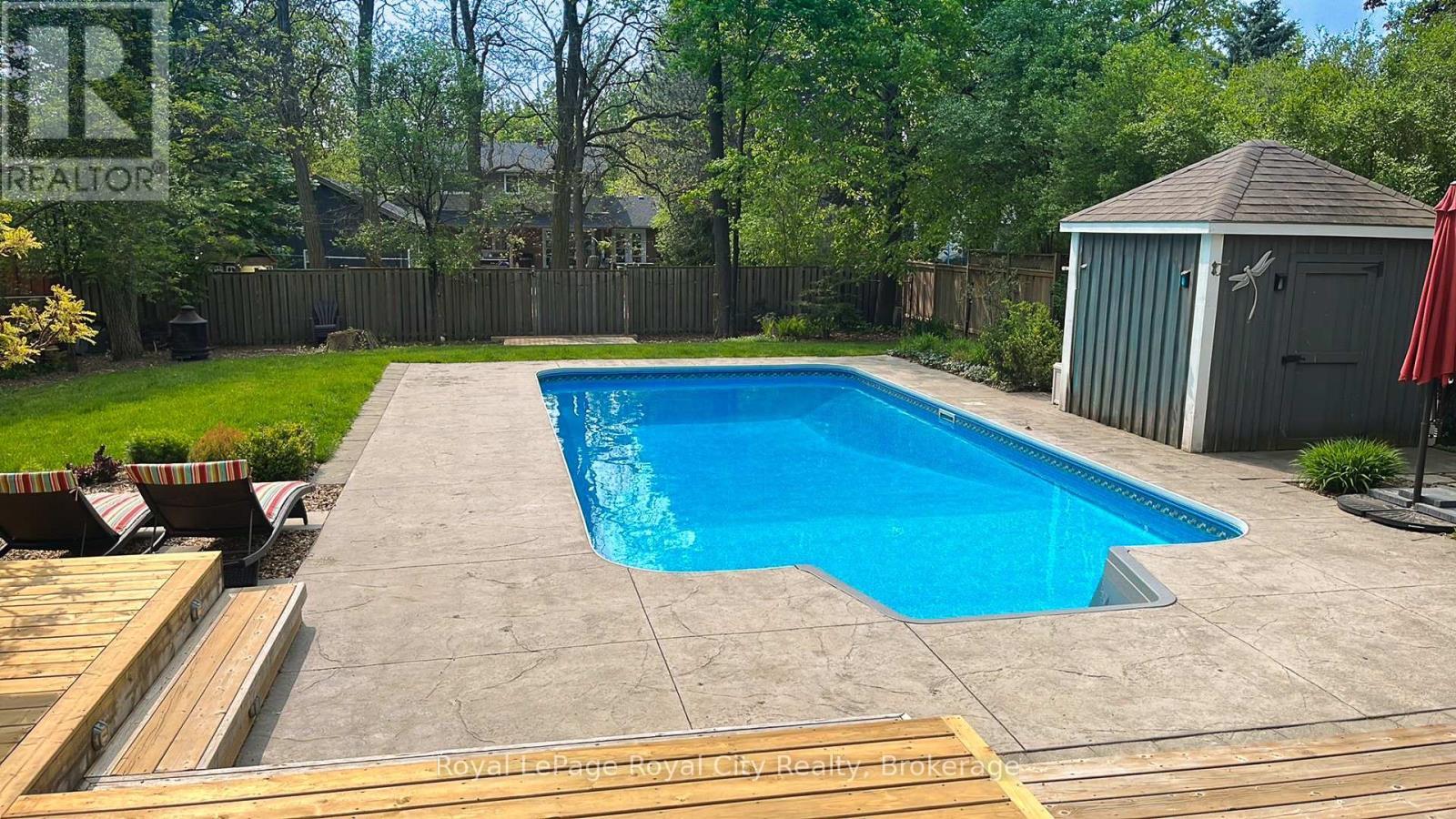 Heated in-ground saltwater pool - 255 Normandy Avenue, Waterloo, ON - Outdoor With In Ground Pool With Backyard