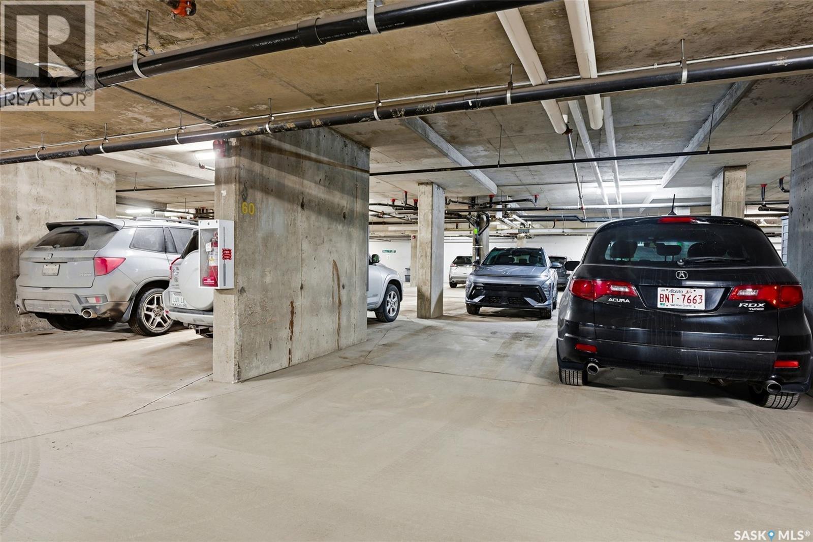 409 5301 Universal Crescent, Regina, SK - Indoor Photo Showing Garage