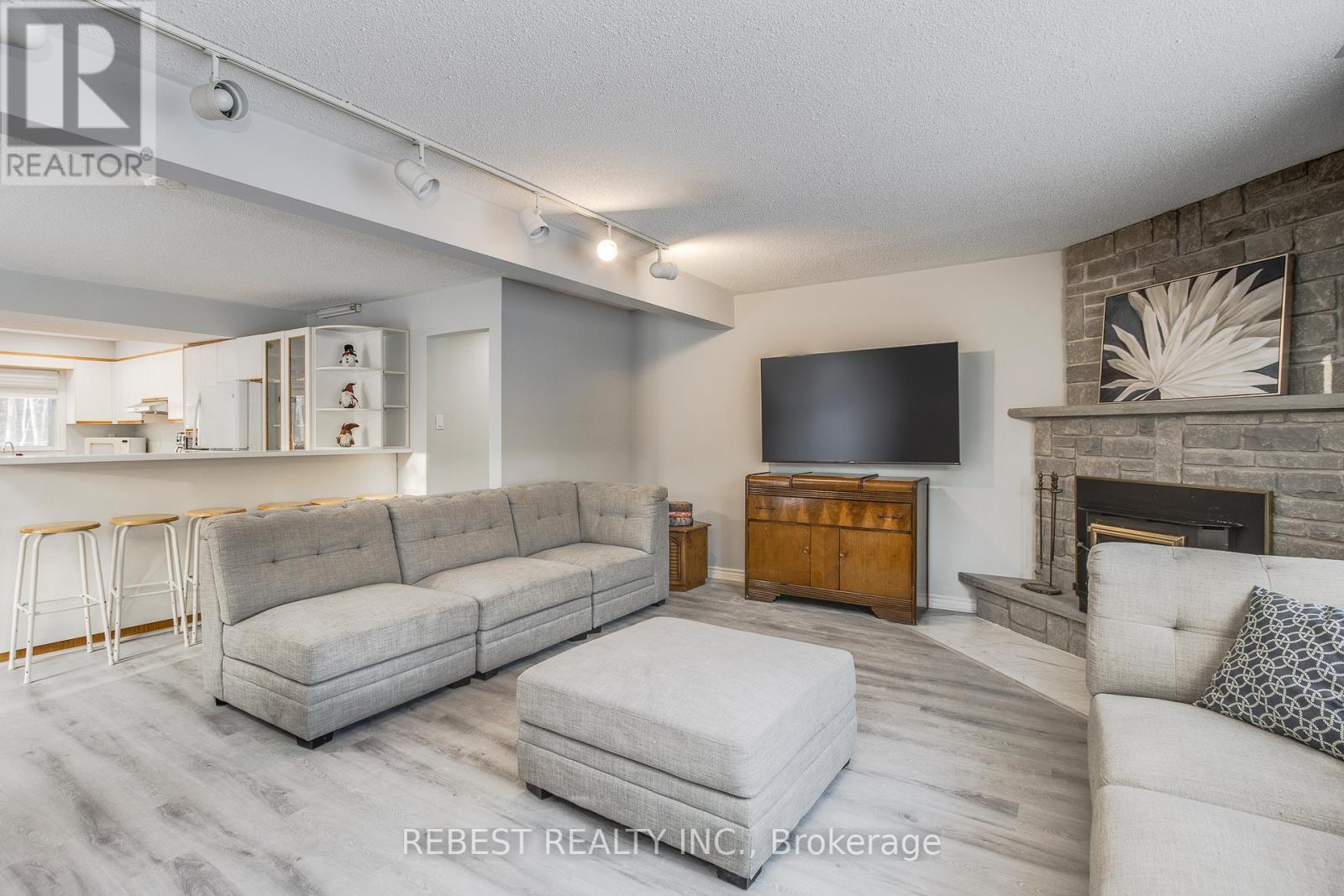 910 Concession Rd 17 W, Tiny, ON - Indoor Photo Showing Living Room With Fireplace