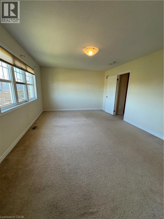 Carpeted empty room featuring baseboards - 50 Shoreacres Drive, Kitchener, ON - Indoor Photo Showing Other Room