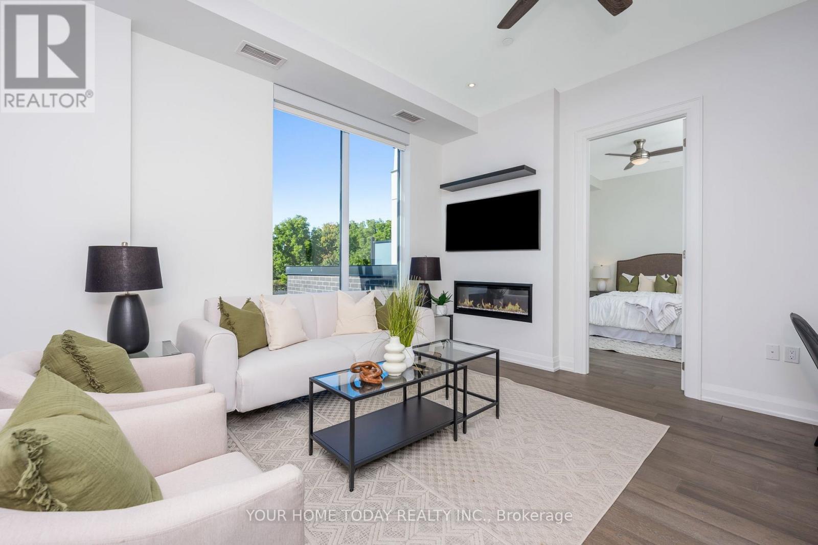610 - 42 Mill Street, Halton Hills, ON - Indoor Photo Showing Living Room With Fireplace