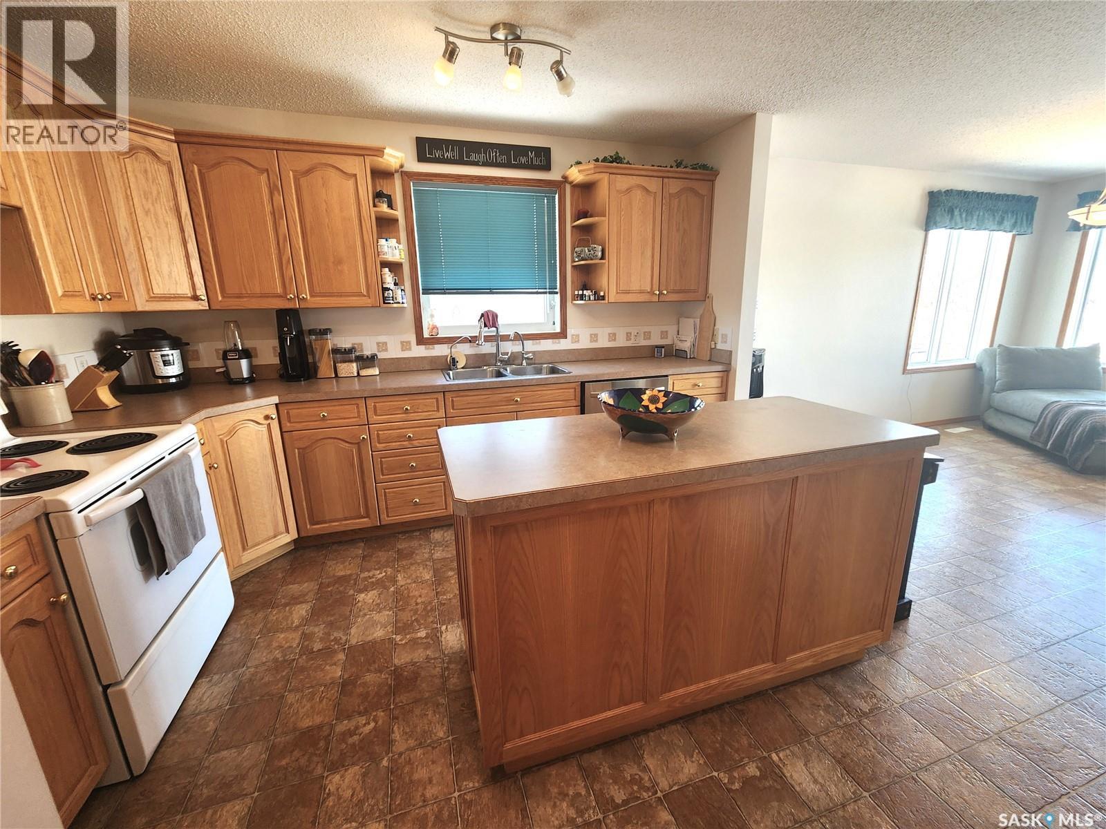 115 Carson Bay, Lampman, SK - Indoor Photo Showing Kitchen With Double Sink