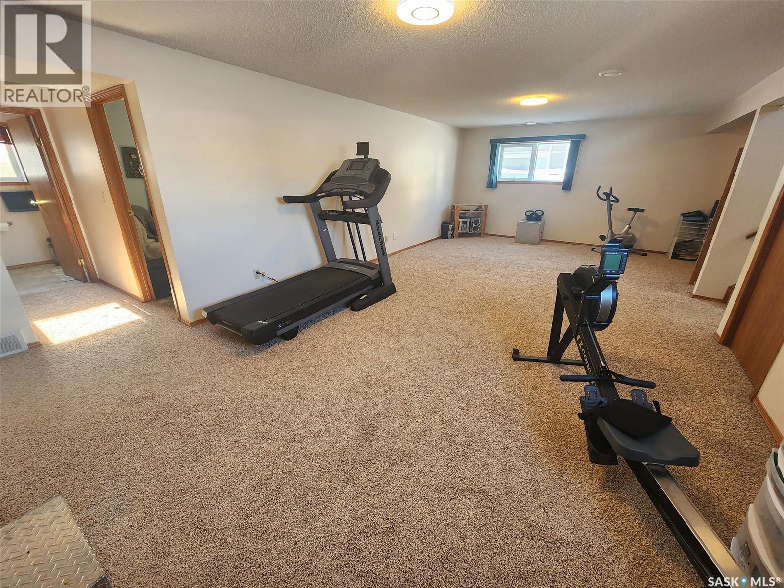115 Carson Bay, Lampman, SK - Indoor Photo Showing Gym Room