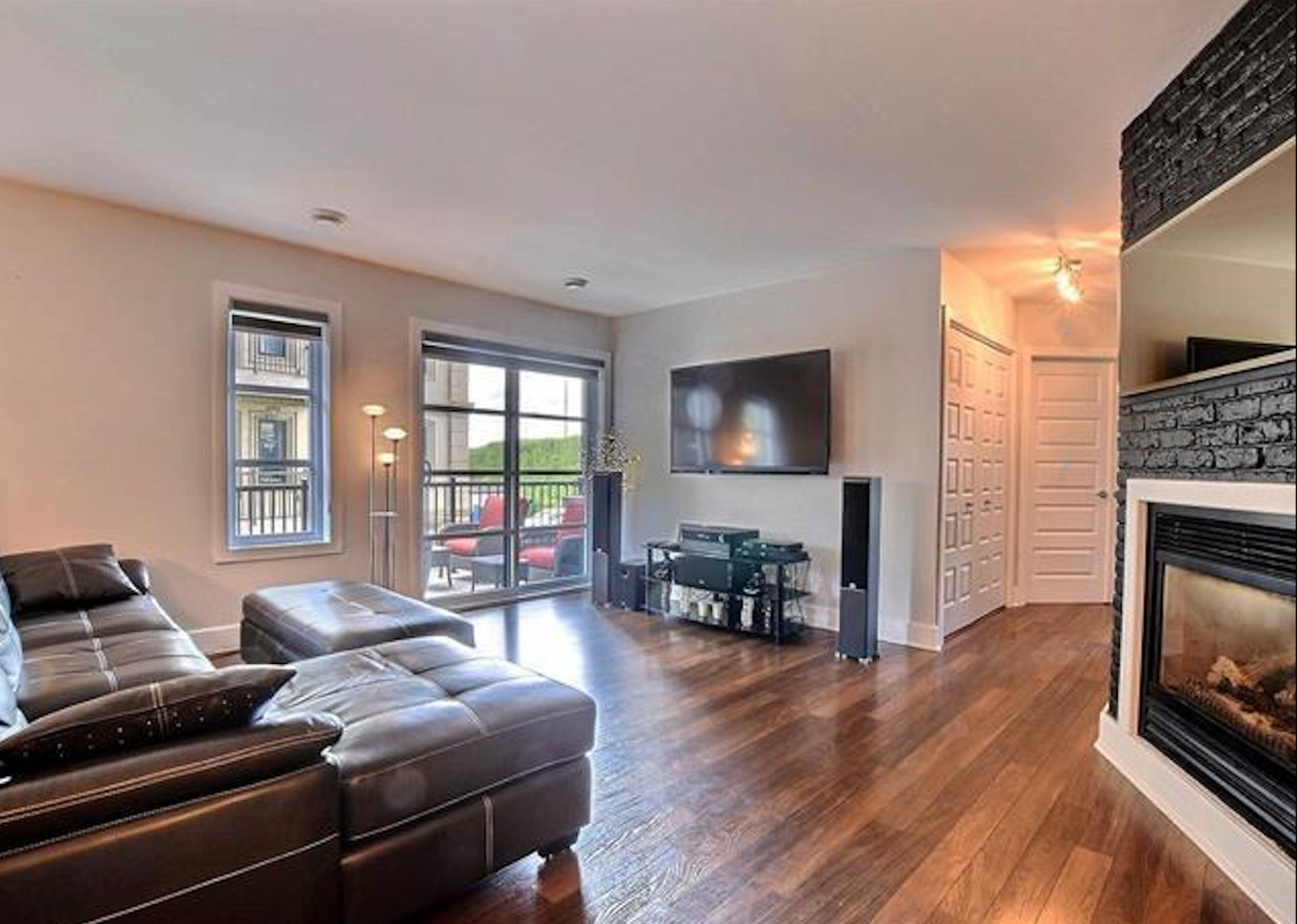 Living Room - 205-65 Rue Des Manoirs, Charlemagne, QC - Indoor Photo Showing Living Room With Fireplace