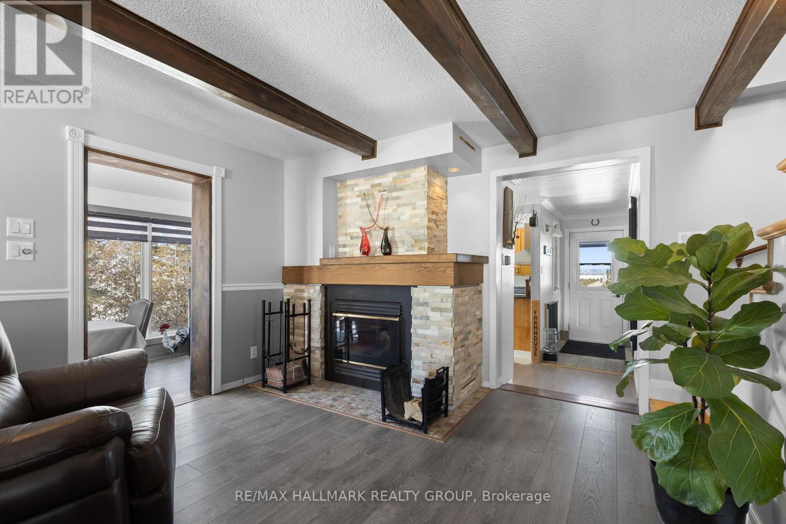 3210 Ritchance Road, Champlain, ON - Indoor Photo Showing Living Room With Fireplace