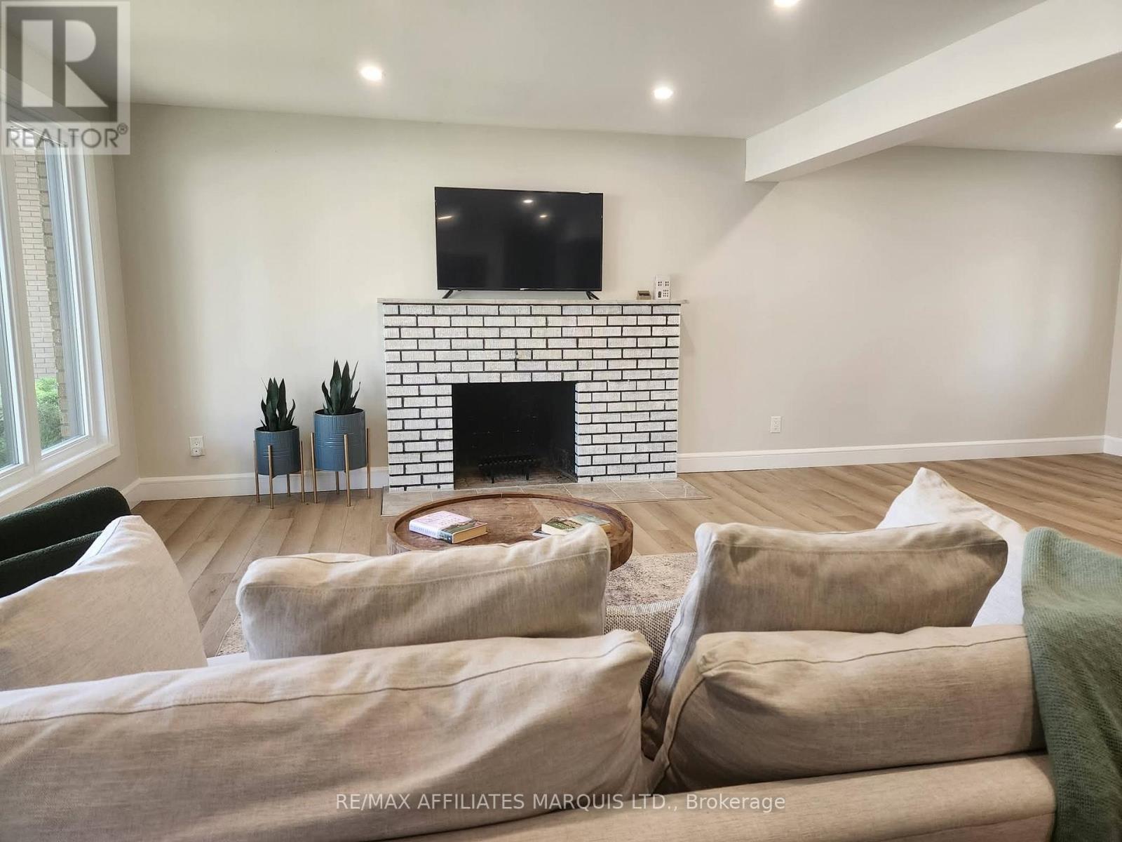 1409 Leonard Avenue, Cornwall, ON - Indoor Photo Showing Other Room With Fireplace