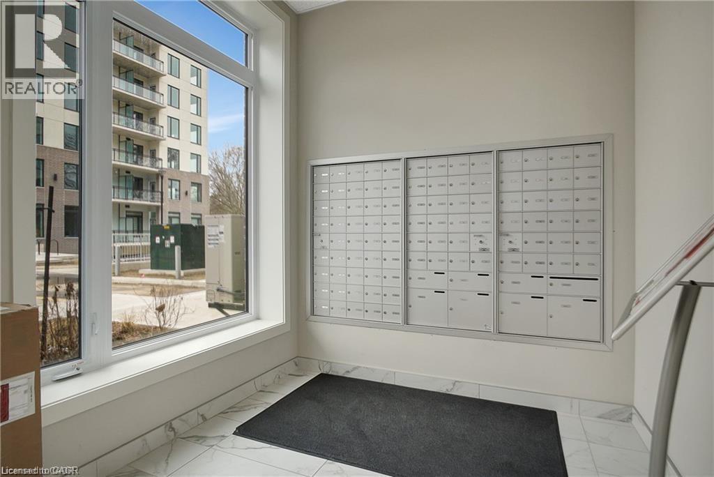 View of home's community with mail area - 103 Roger Street Unit# 310, Waterloo, ON - Indoor Photo Showing Other Room