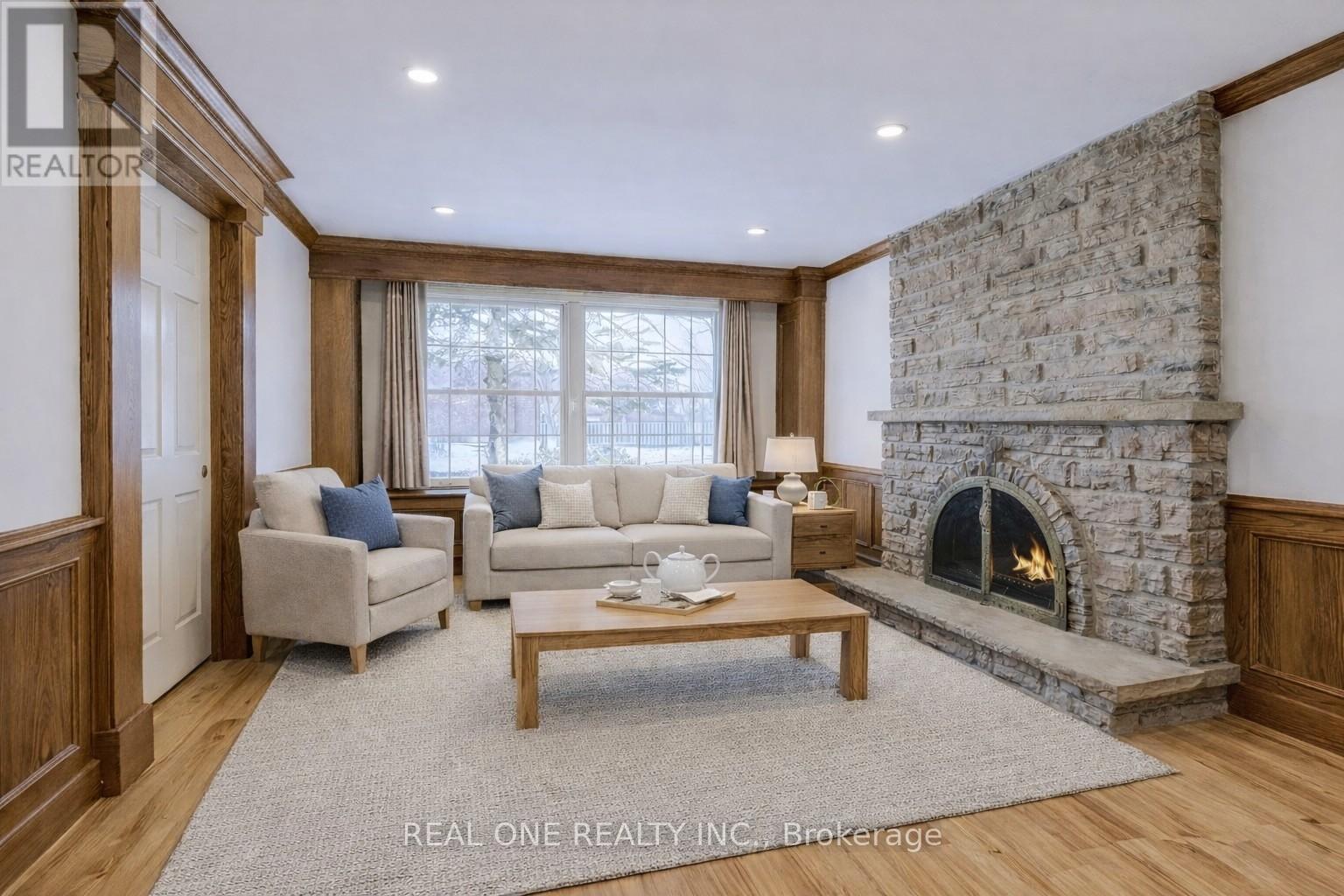 Virtually Staged Family Room Sitting Area - 1585 Crombie Road, Mississauga, ON - Indoor Photo Showing Living Room With Fireplace