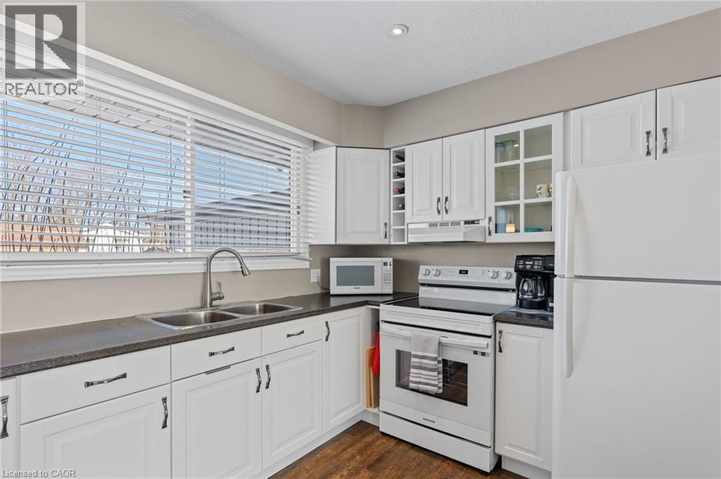 218 Arris Crescent, Mitchell, ON - Indoor Photo Showing Kitchen With Double Sink