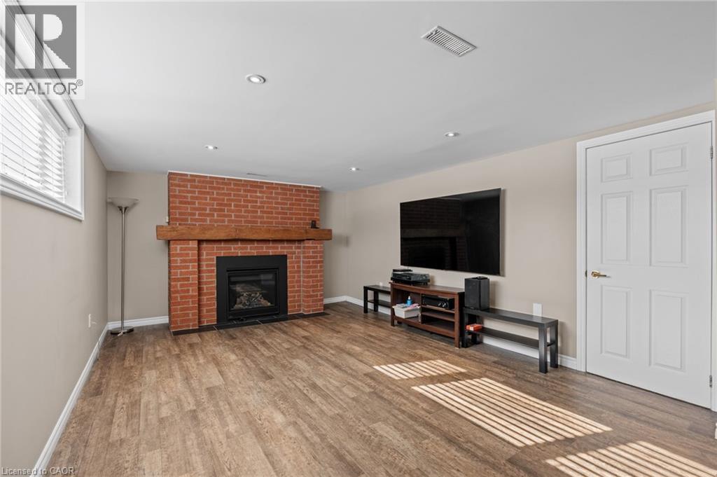 218 Arris Crescent, Mitchell, ON - Indoor Photo Showing Living Room With Fireplace