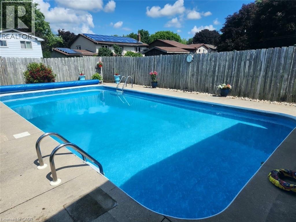 218 Arris Crescent, Mitchell, ON - Outdoor With In Ground Pool With Backyard