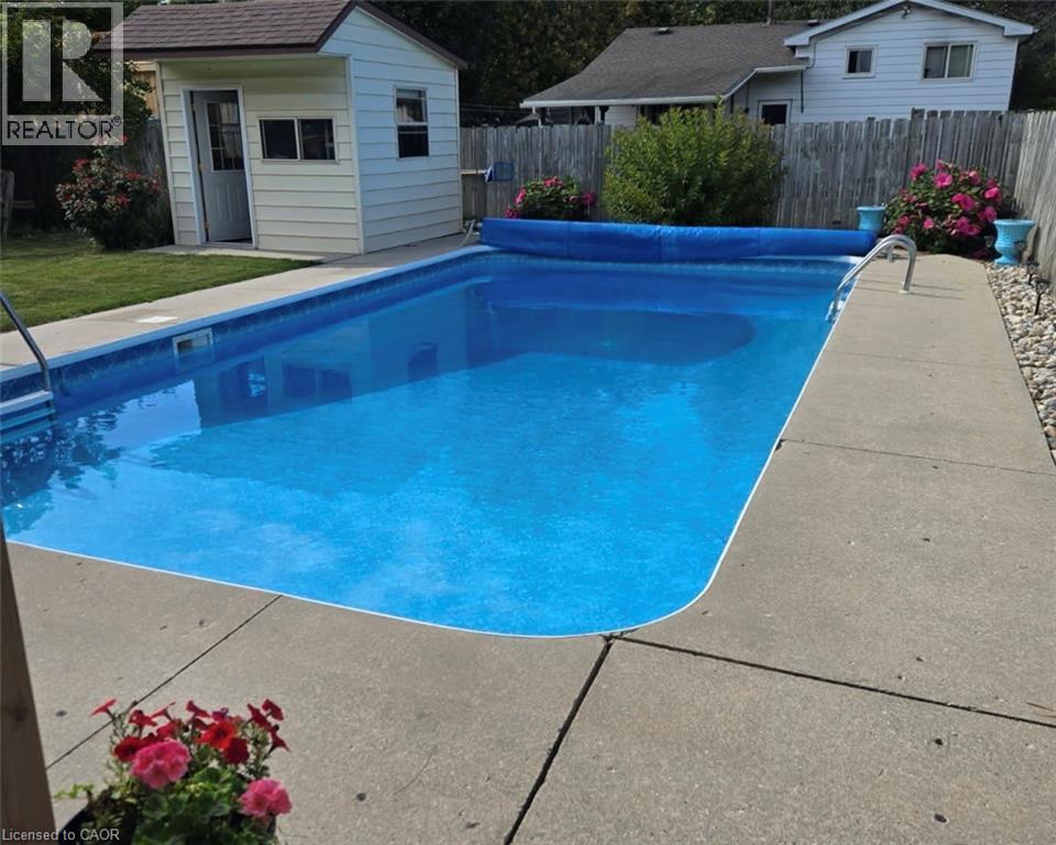 218 Arris Crescent, Mitchell, ON - Outdoor With In Ground Pool