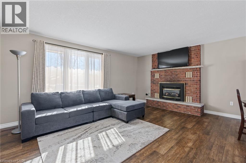 218 Arris Crescent, Mitchell, ON - Indoor Photo Showing Living Room With Fireplace