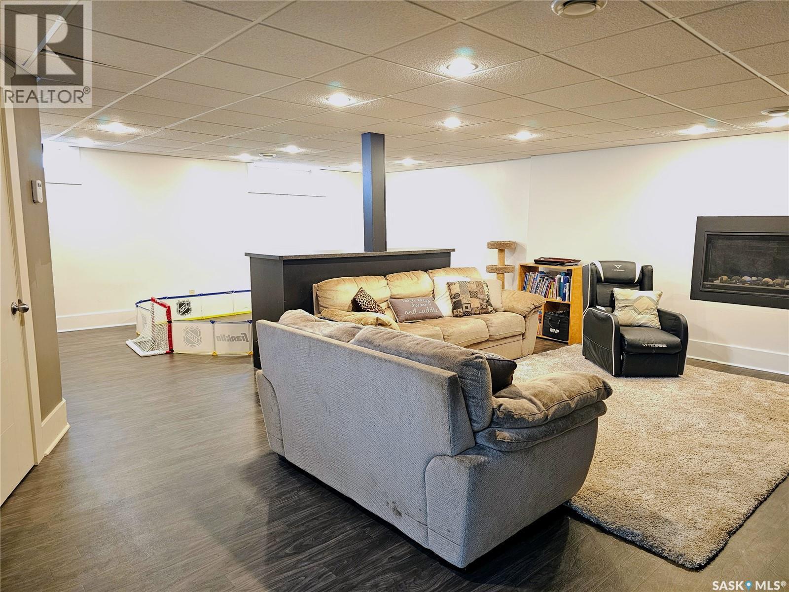 26 Barnes Crescent, Humboldt, SK - Indoor Photo Showing Other Room With Fireplace