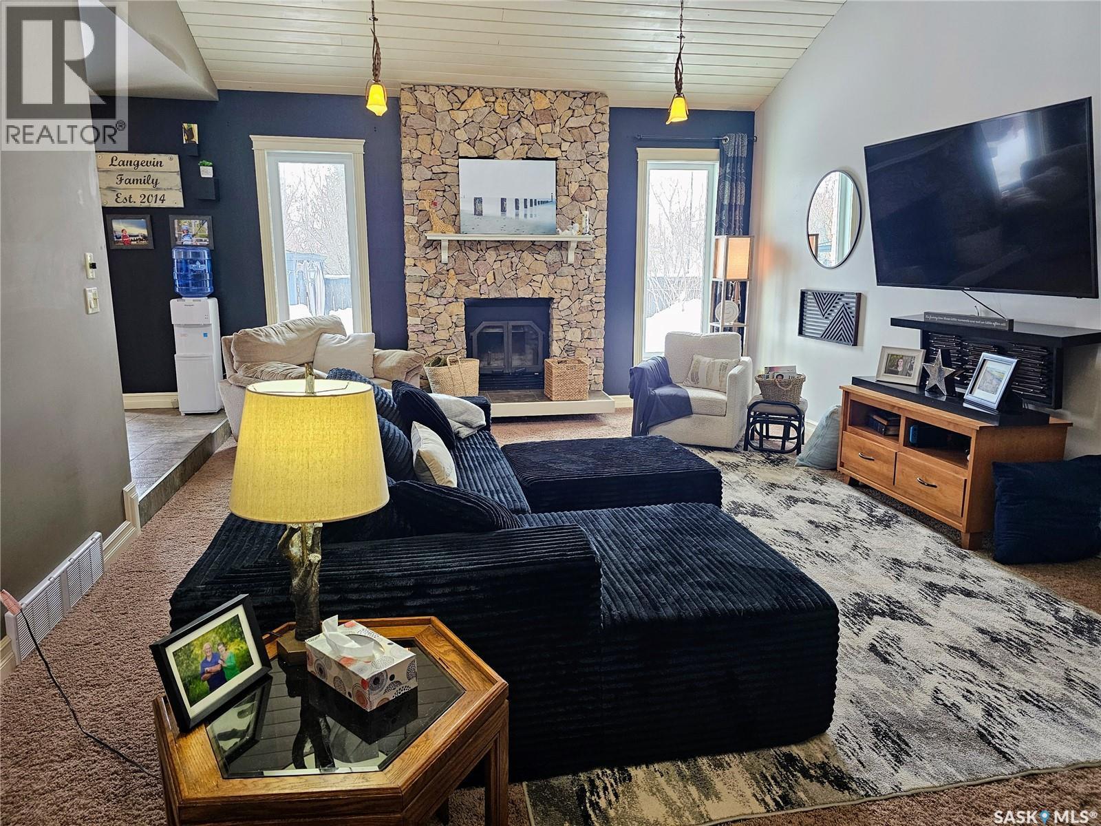 26 Barnes Crescent, Humboldt, SK - Indoor Photo Showing Living Room With Fireplace