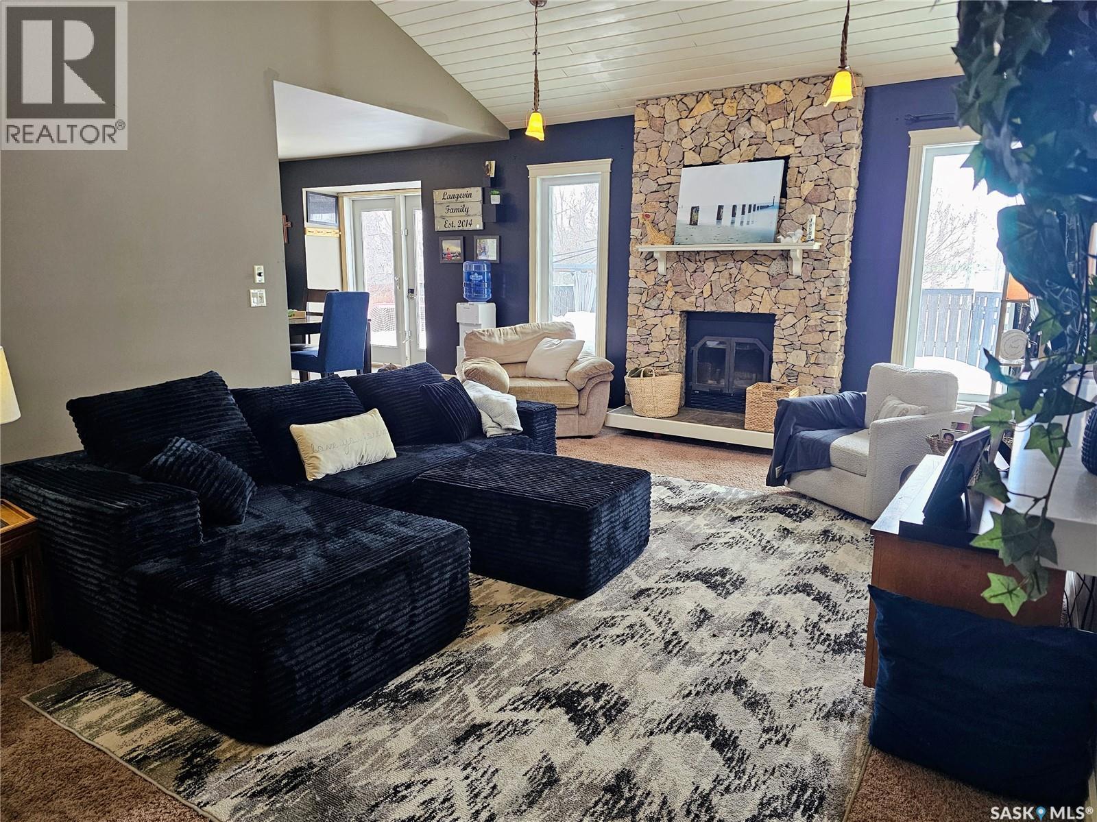 26 Barnes Crescent, Humboldt, SK - Indoor Photo Showing Living Room With Fireplace