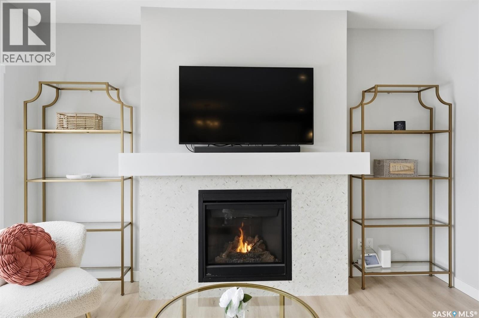 406 Chelsom Manor, Saskatoon, SK - Indoor Photo Showing Living Room With Fireplace
