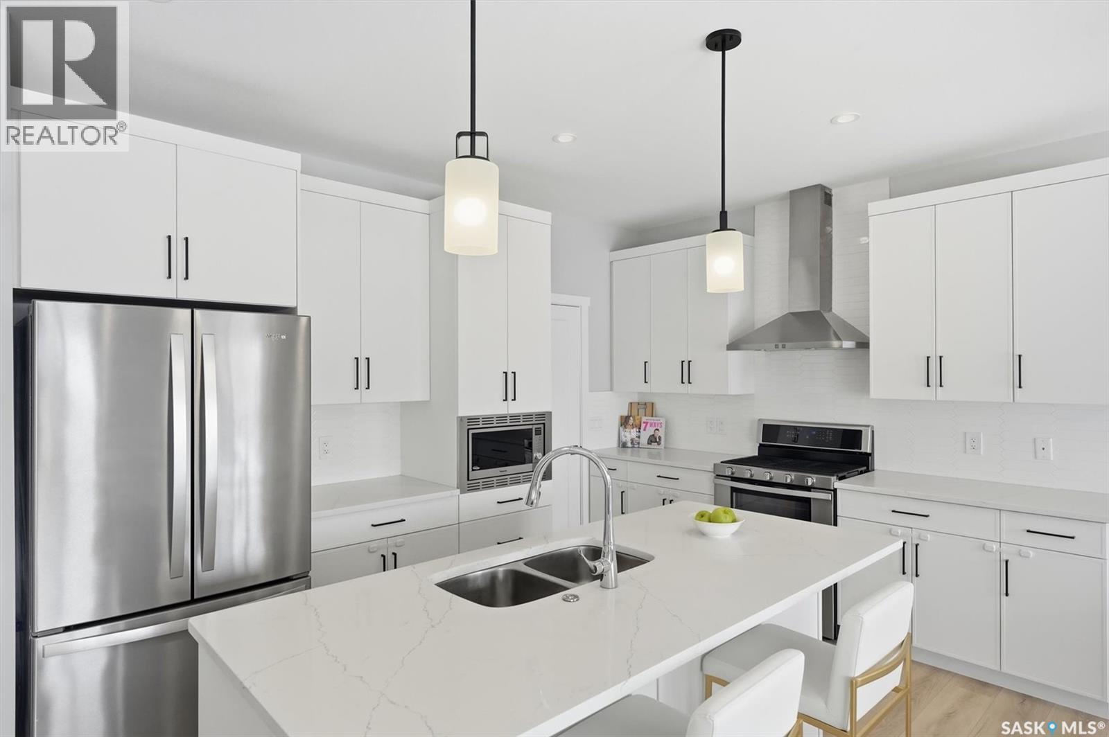 406 Chelsom Manor, Saskatoon, SK - Indoor Photo Showing Kitchen With Double Sink With Upgraded Kitchen