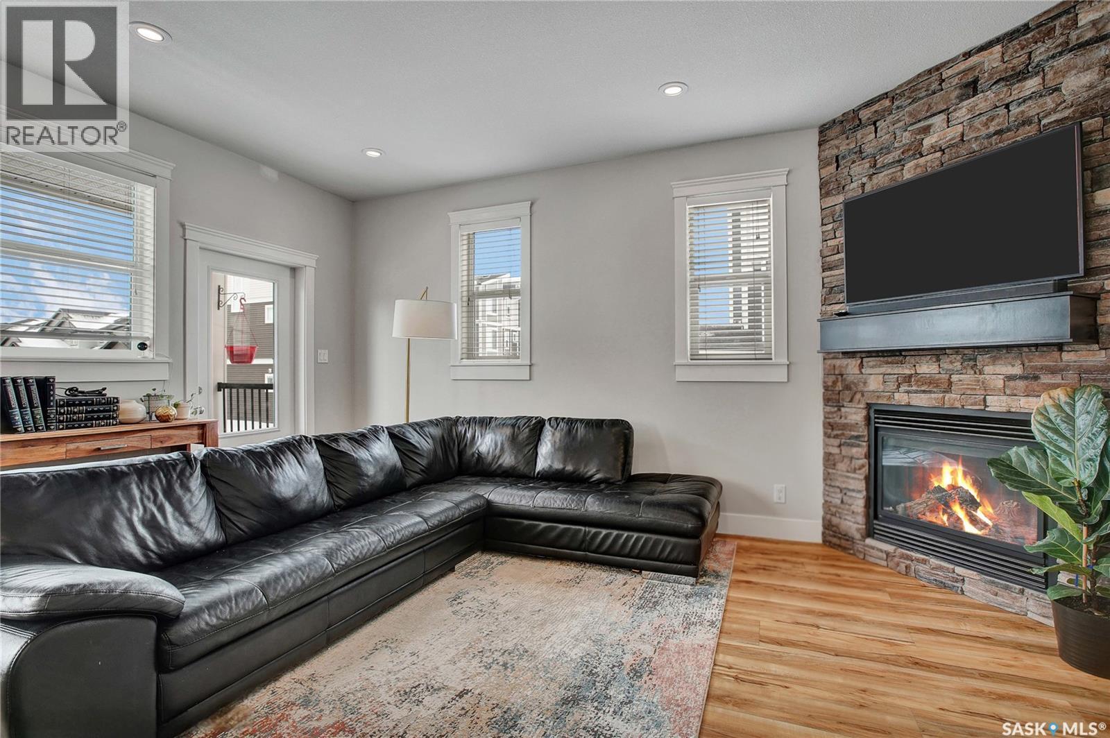 13 600 Maple Crescent, Warman, SK - Indoor Photo Showing Living Room With Fireplace
