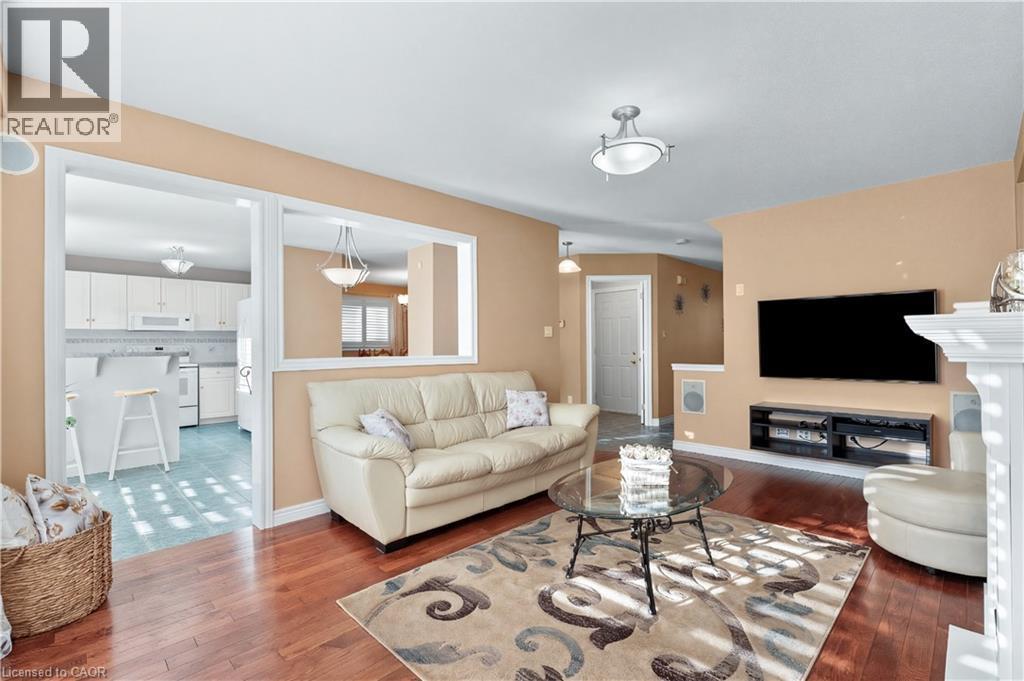 Living area featuring hardwood flooring - 42 Archer Way, Hamilton, ON - Indoor Photo Showing Living Room With Fireplace