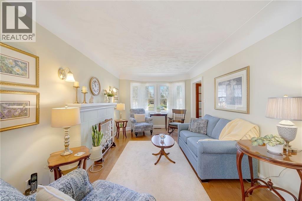 22 Churchill Avenue, Hamilton, ON - Indoor Photo Showing Living Room With Fireplace