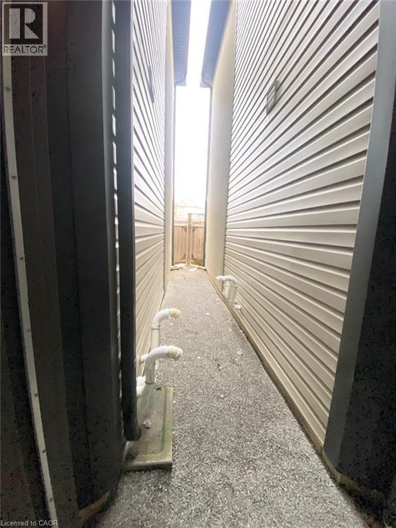 Garage door to rear yard - 72 Dodman Crescent, Ancaster, ON - Indoor Photo Showing Other Room