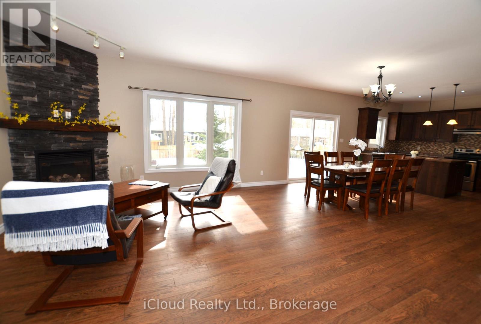 25 Rue Vanier, Tiny, ON - Indoor Photo Showing Dining Room With Fireplace