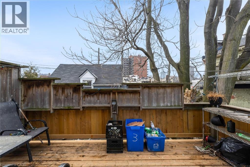 View of patio / terrace featuring a deck - 320 King Street E, Hamilton, ON
