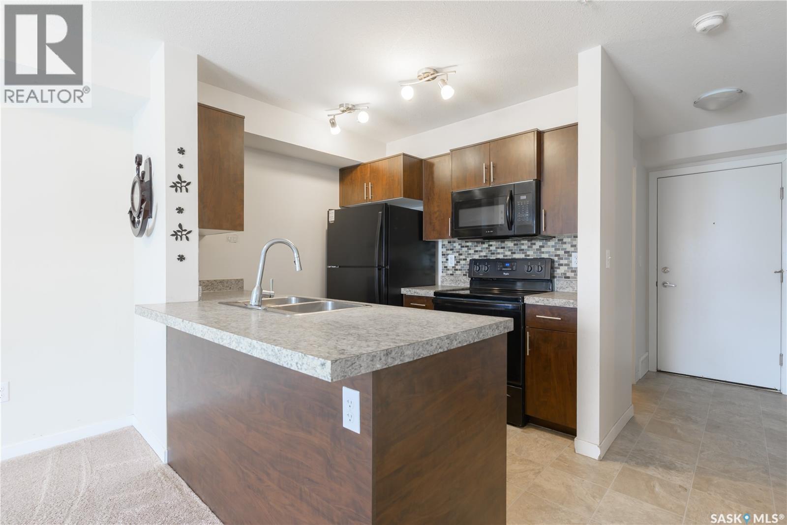 1121 5500 Mitchinson Way, Regina, SK - Indoor Photo Showing Kitchen With Double Sink