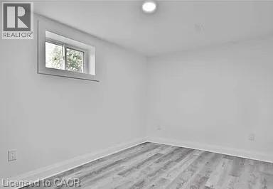 Bedroom 1 with light wood finished floors - 549 Waterloo Street, Hamilton, ON - Indoor Photo Showing Other Room