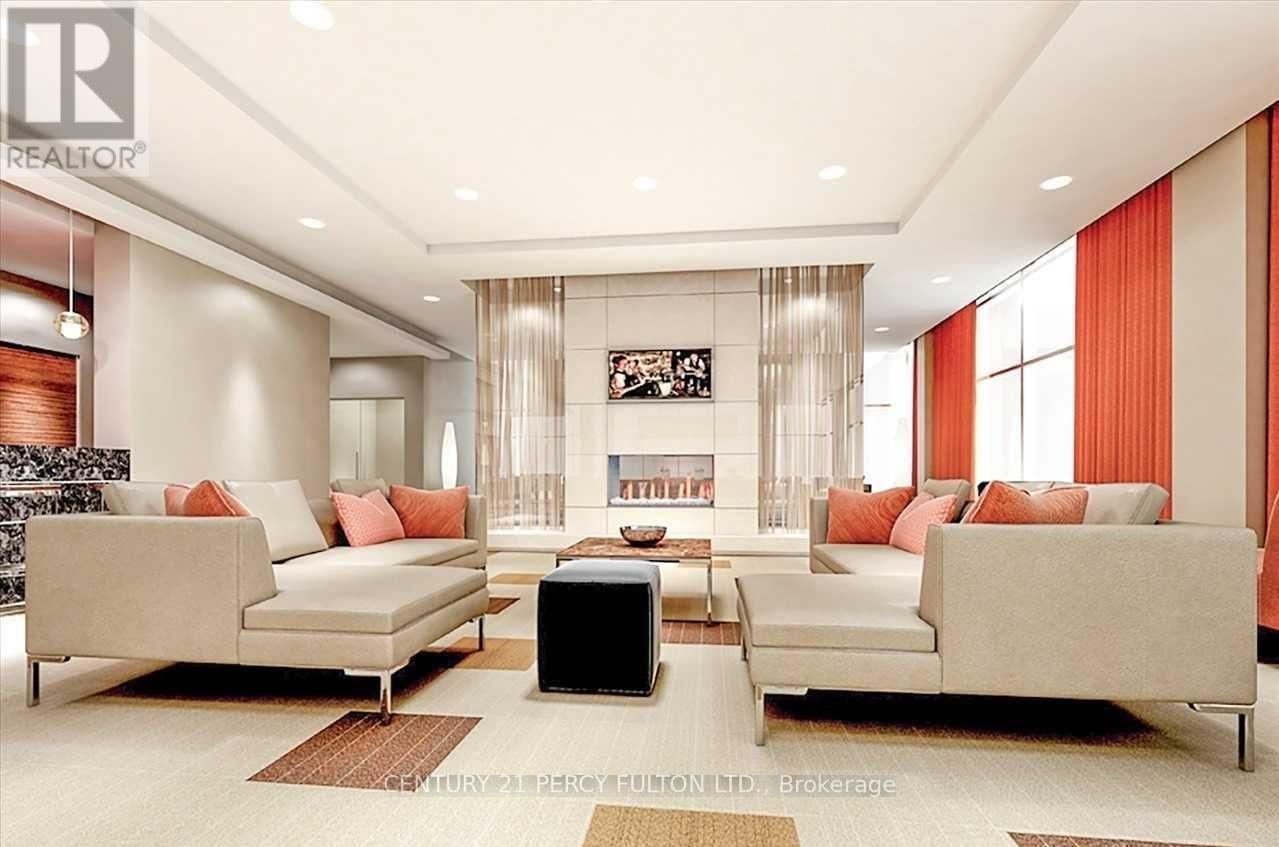 314 - 181 Village Green Square, Toronto, ON - Indoor Photo Showing Living Room With Fireplace