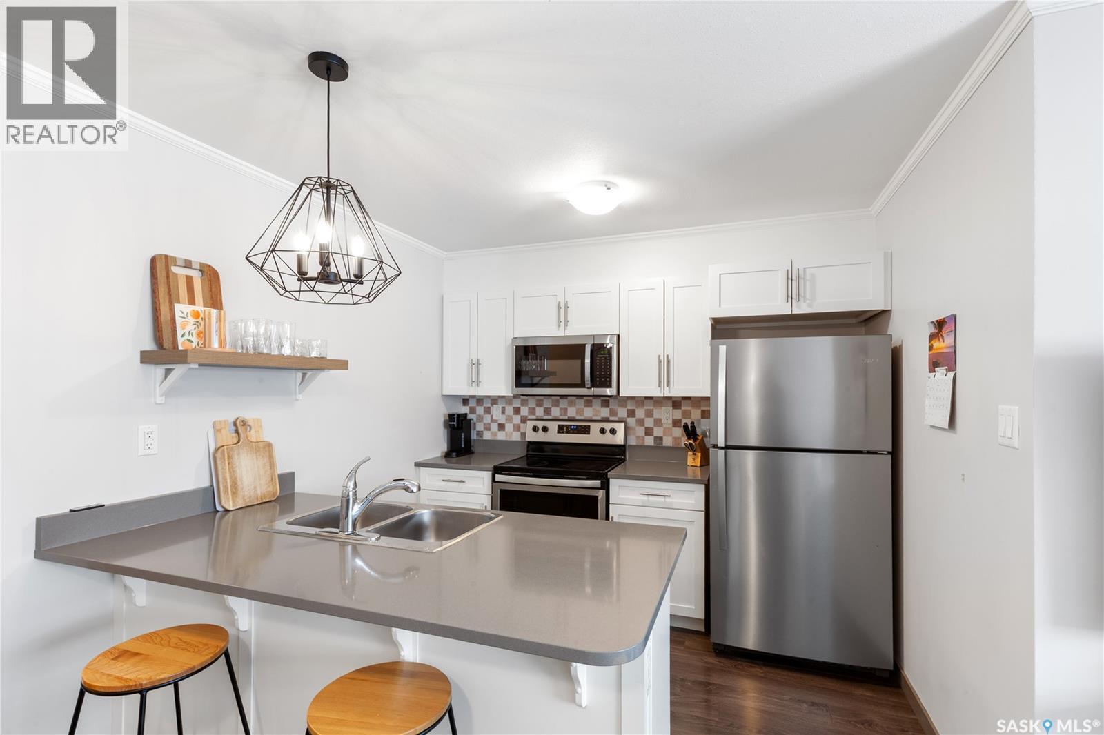 320 522 Cornish Road, Saskatoon, SK - Indoor Photo Showing Kitchen With Stainless Steel Kitchen With Double Sink