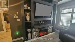 Entertainment area with b/i electric fireplace. -