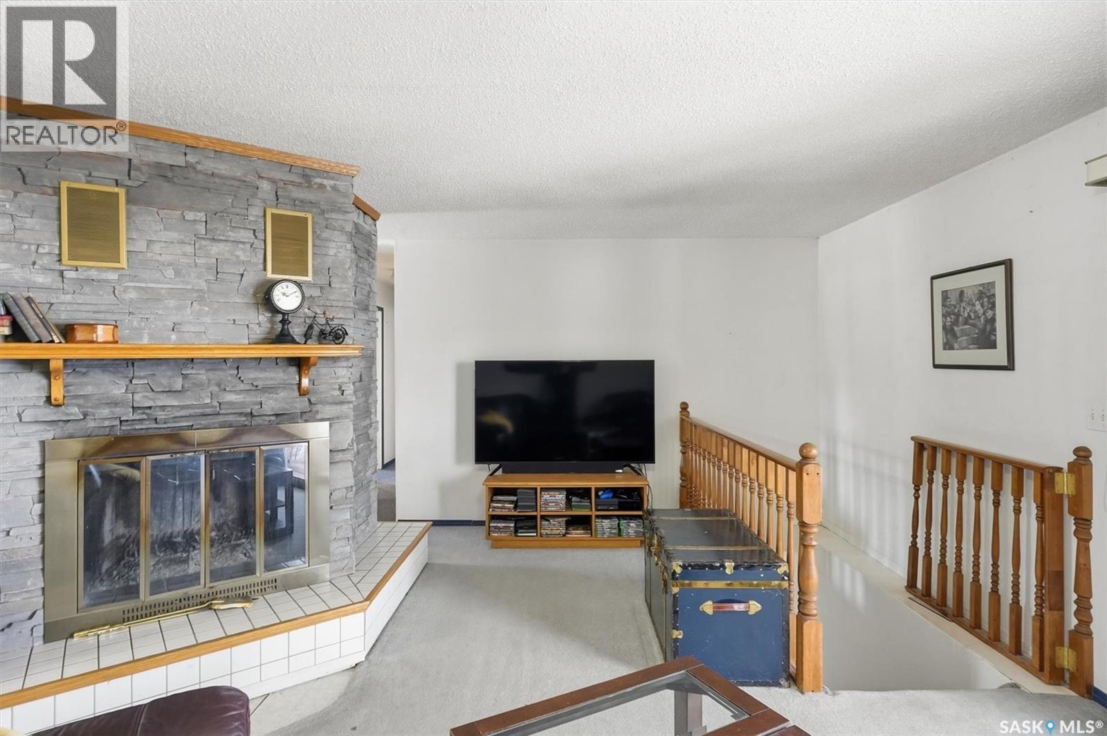 48 Procter Drive, Shields, SK - Indoor Photo Showing Living Room With Fireplace