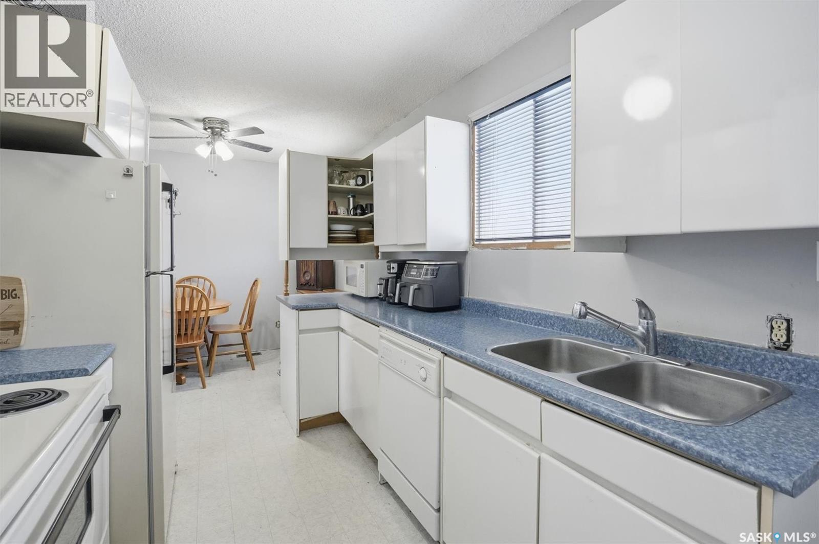 48 Procter Drive, Shields, SK - Indoor Photo Showing Kitchen With Double Sink