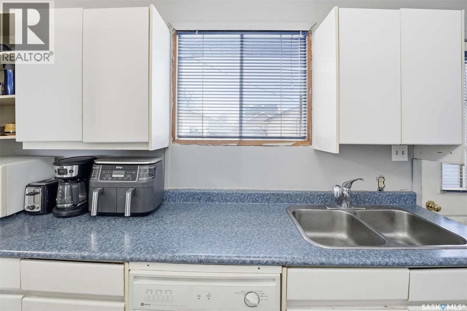 48 Procter Drive, Shields, SK - Indoor Photo Showing Kitchen With Double Sink
