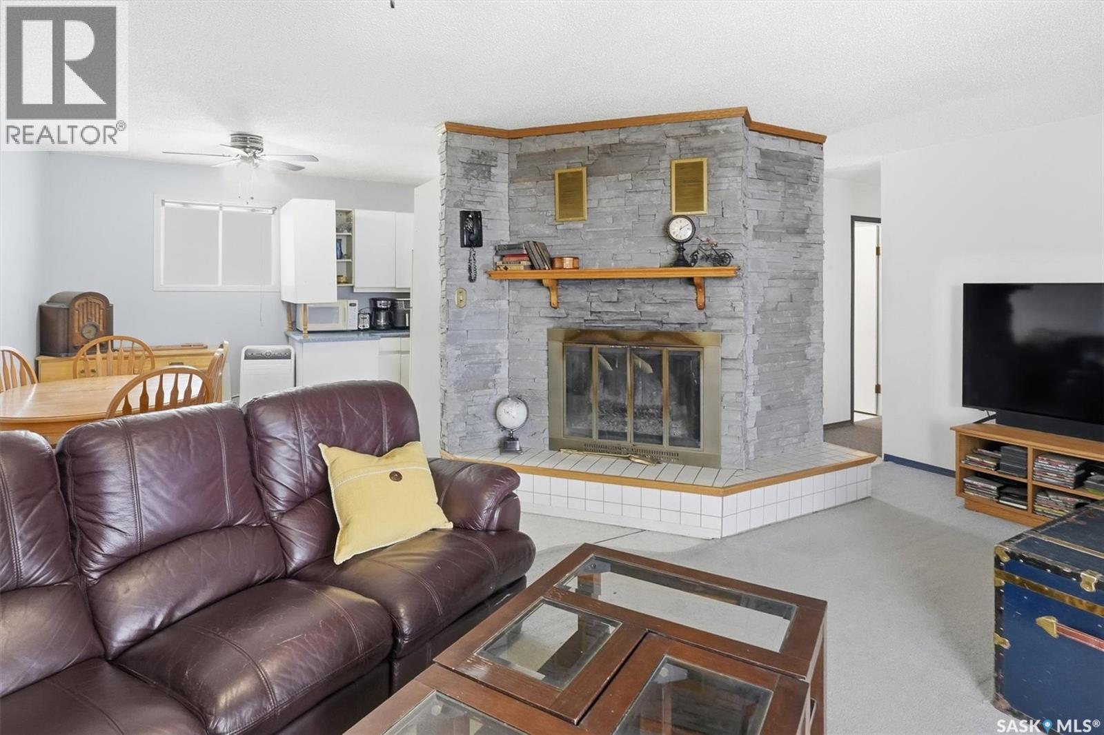 48 Procter Drive, Shields, SK - Indoor Photo Showing Living Room With Fireplace