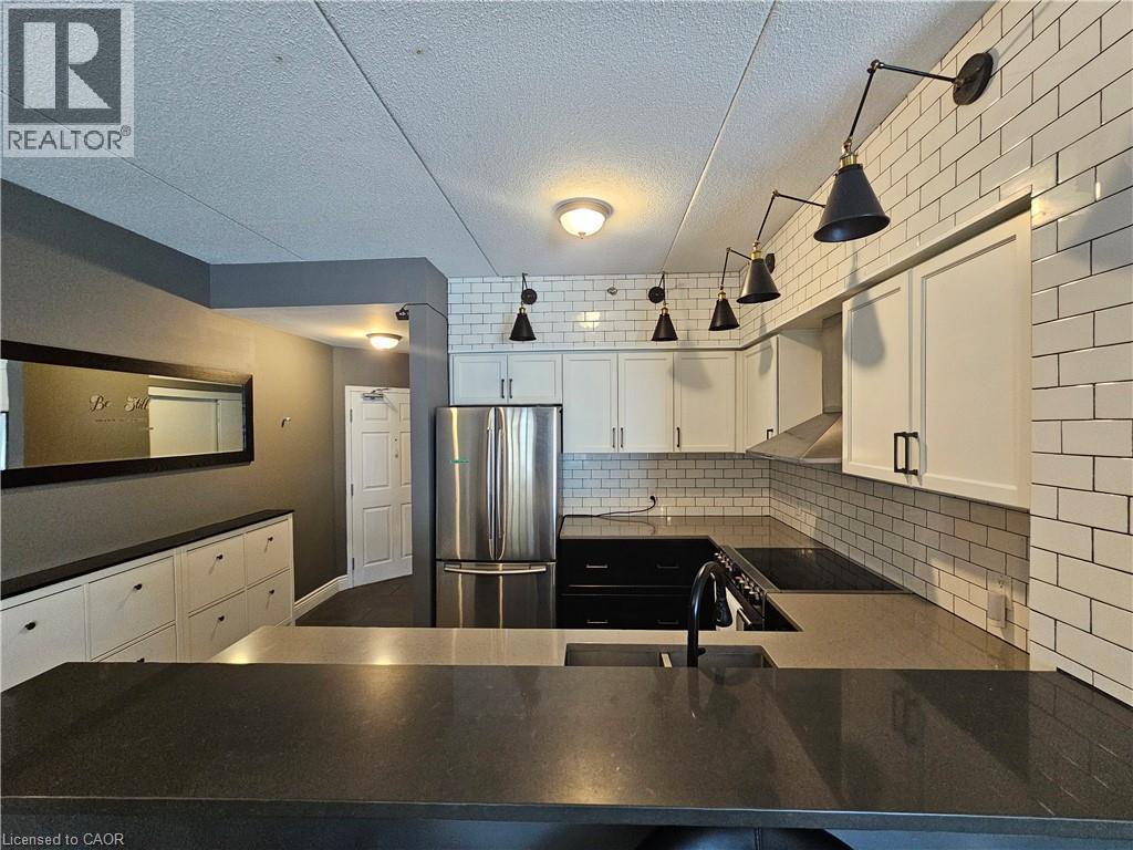 308 Watson Parkway N Unit# 102, Guelph, ON - Indoor Photo Showing Kitchen With Double Sink