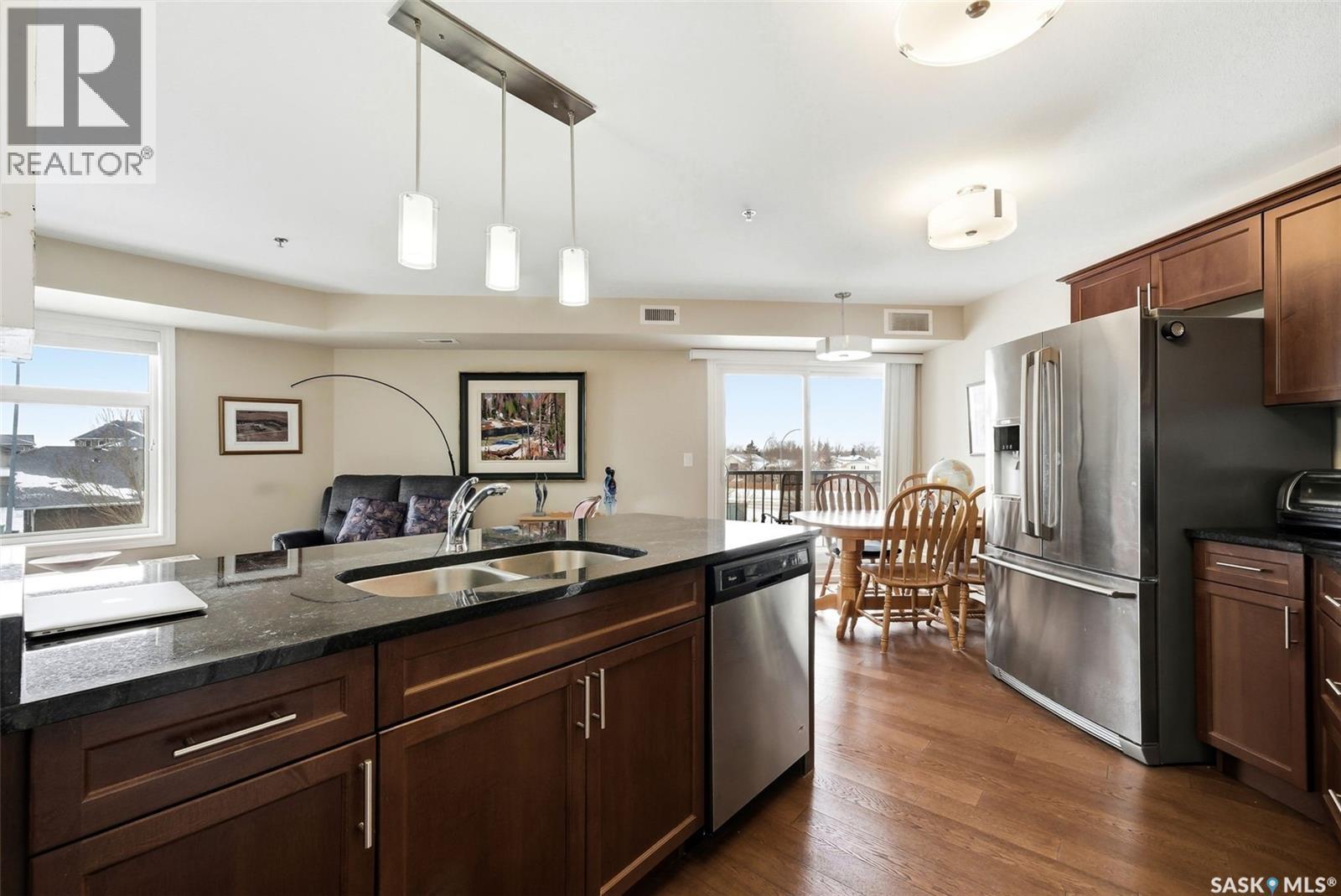 214 3630 Haughton Road E, Regina, SK - Indoor Photo Showing Kitchen With Double Sink