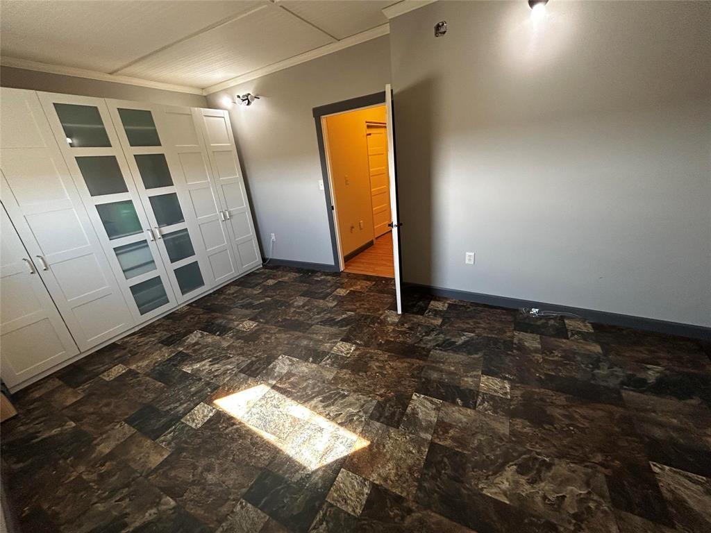 Very grande primary bedroom with ikea cabinetry that has an abundance of storage and hanging space etc. (included in the sale) - Pierson, Manitoba