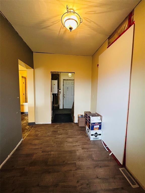 Mudroom and utility room. Exit points at both ends and access to the single attached garage that is mostly insulated and ready for drywall. - Pierson, Manitoba