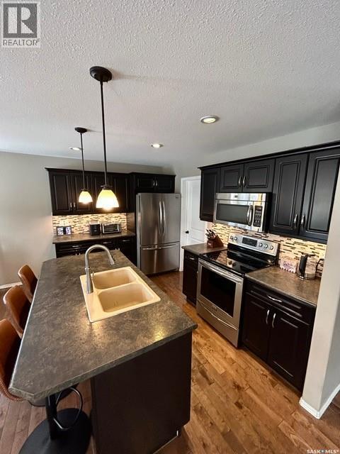 5245 Canuck Crescent, Regina, SK - Indoor Photo Showing Kitchen With Stainless Steel Kitchen With Double Sink