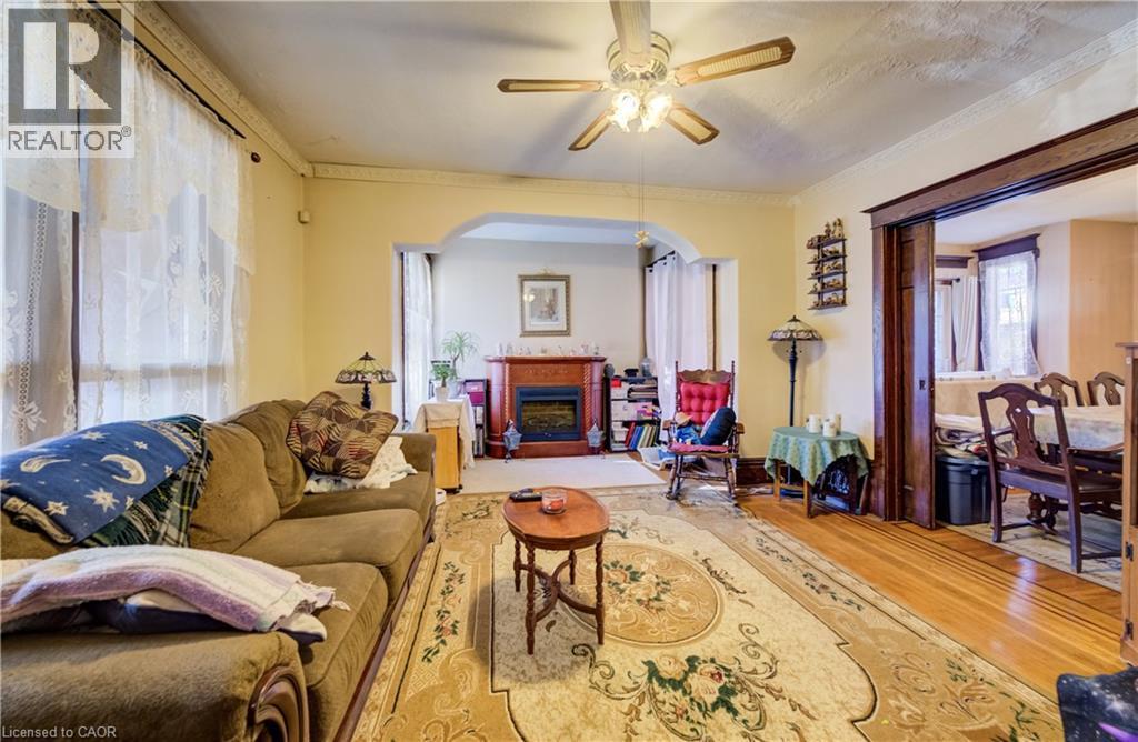 formal living room, oak, walnut inlaid floors - 12 Leinster Avenue S, Hamilton, ON - Indoor Photo Showing Living Room With Fireplace