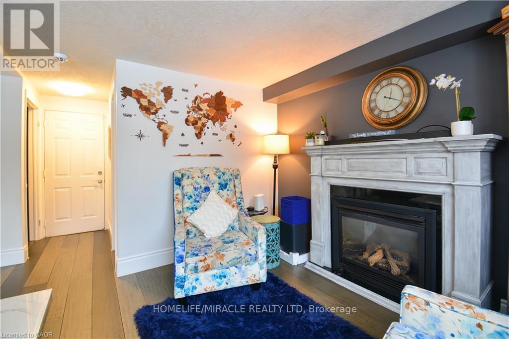 39 Endeavour Drive, Cambridge, ON - Indoor Photo Showing Living Room With Fireplace