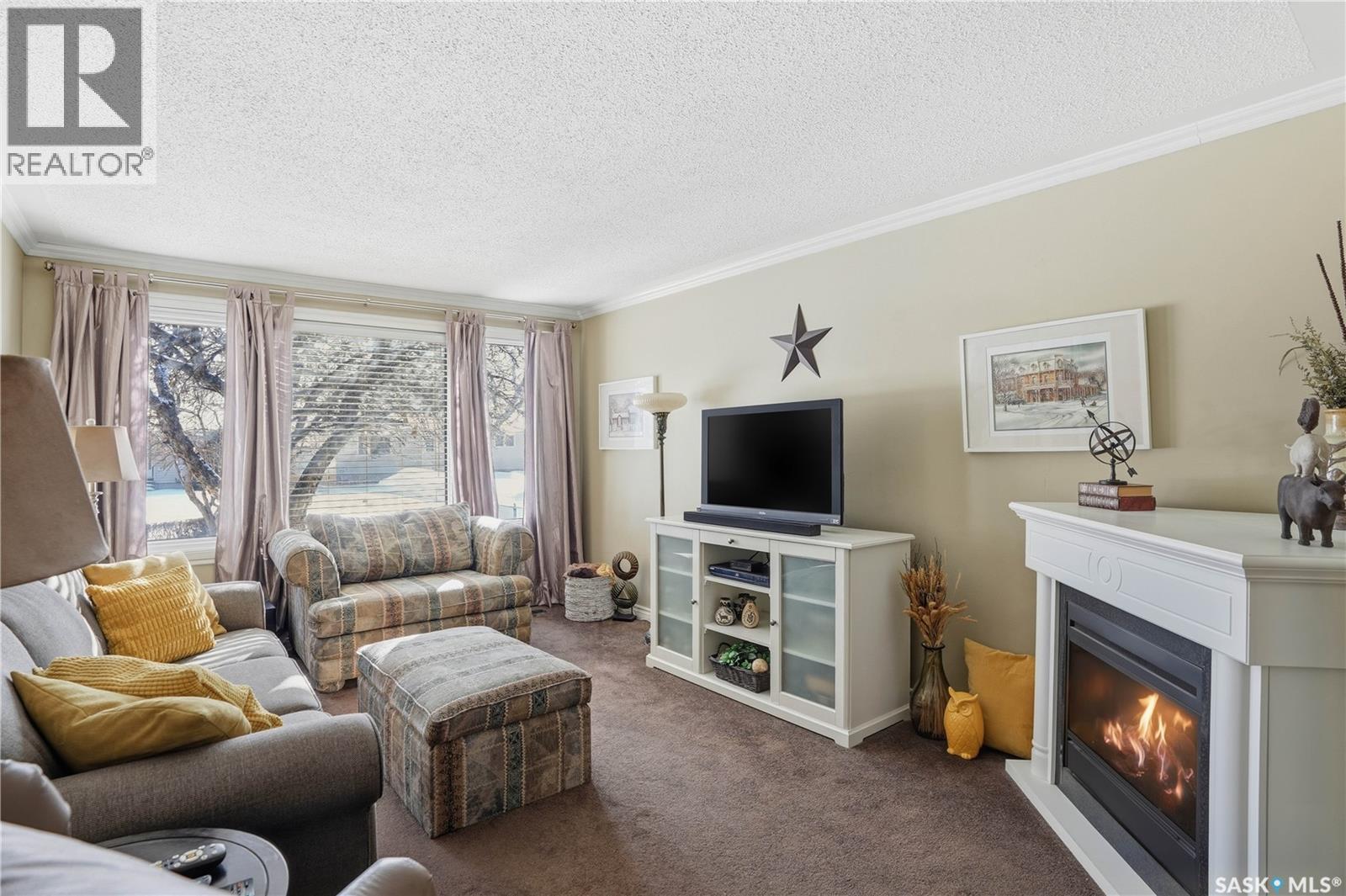 39 Bedford Crescent, Regina, SK - Indoor Photo Showing Living Room With Fireplace