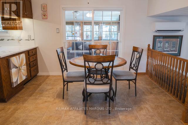 Dining area with patio doors to sunroom - 577 Lynwood Drive, Cornwall, ON - Indoor Photo Showing Dining Room